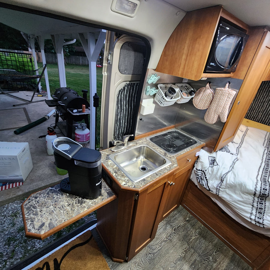 and bed/lounge area floor plan for easy travel.|RV rental interior: front swivel seats