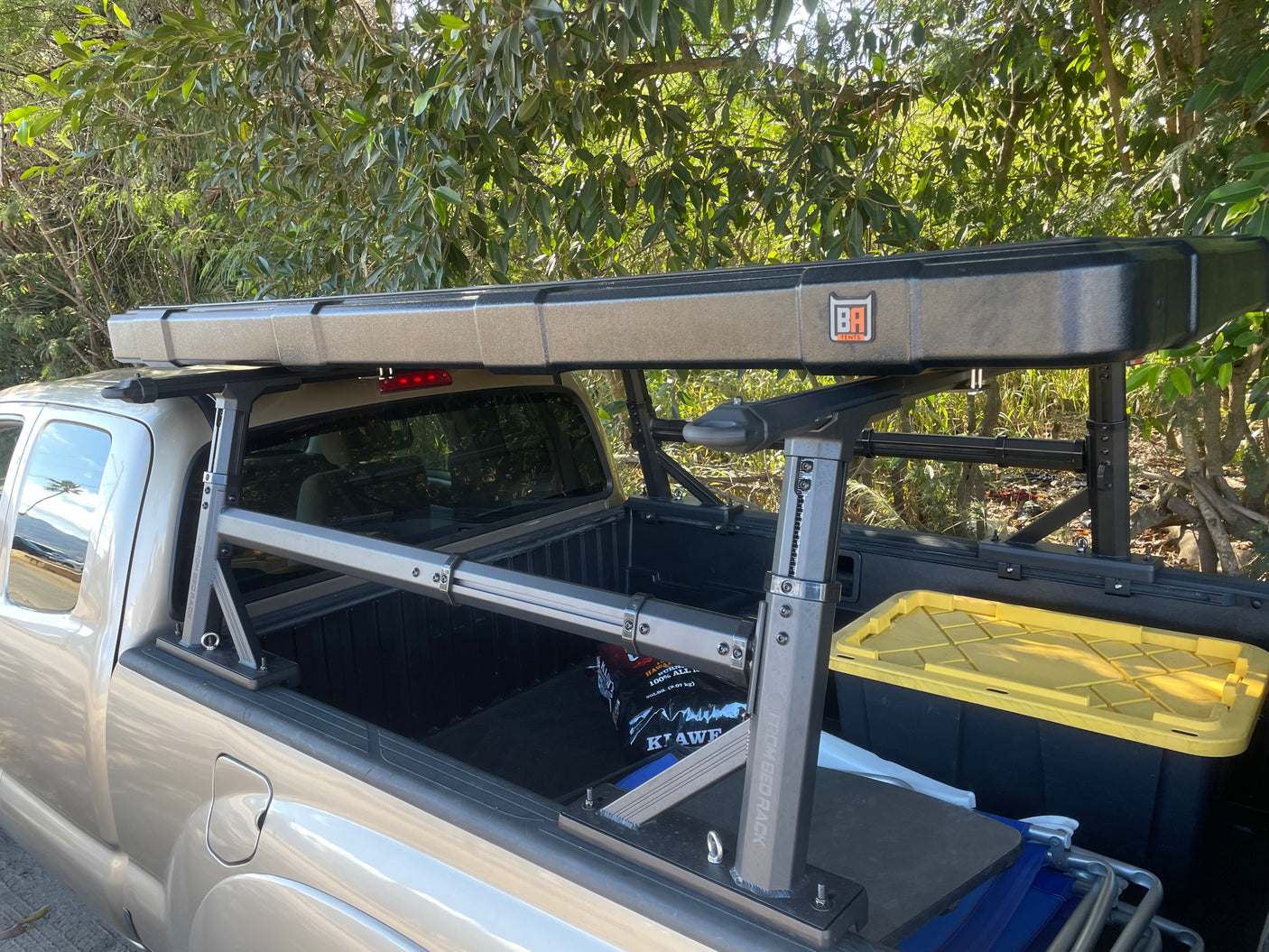 Truck equipped with 'From Bed Rack' and a 'BA Tents' rooftop tent, an ideal RV rental alternative for your overland adventure.