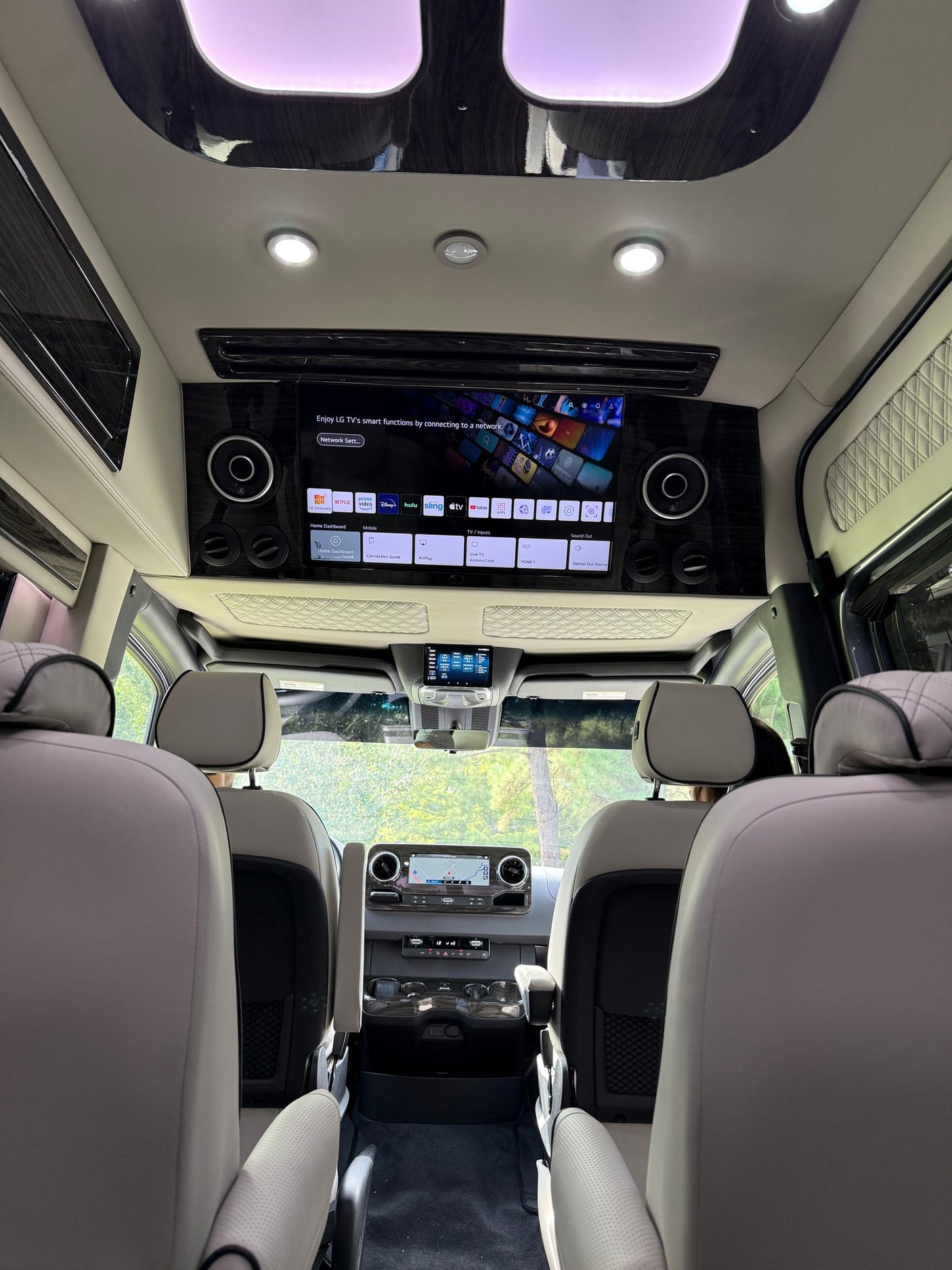 showcasing a compact interior with a toilet and cabinetry. Ideal for travel.|Experience luxury travel in this RV rental's spacious interior