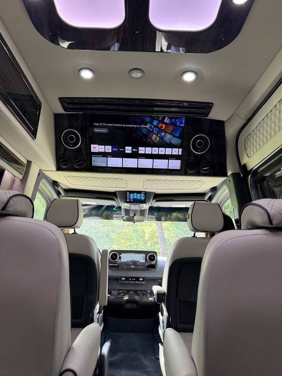 showcasing a compact interior with a toilet and cabinetry. Ideal for travel.|Experience luxury travel in this RV rental's spacious interior