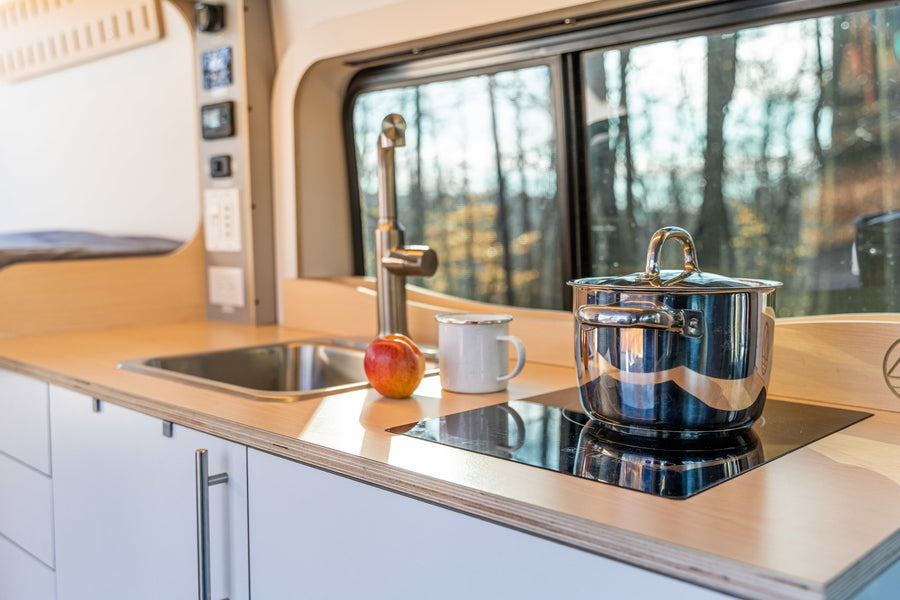 tree-covered mountain backdrop.|Compact