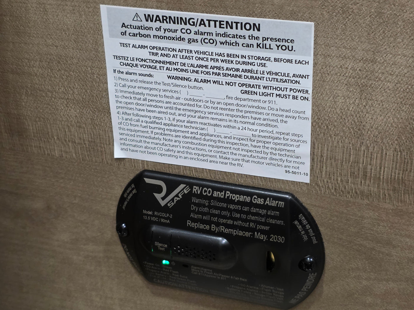RV rental: CO and Propane Gas Alarm with crucial safety warnings and emergency instructions for gas detection.