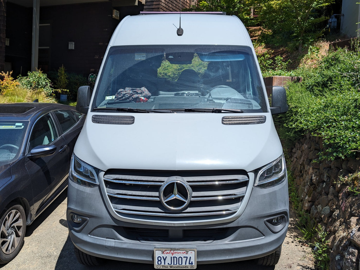 commonly used for RV rental. California plate 8YJD074 visible.|Front view of a white Mercedes-Benz Sprinter van — photo 5