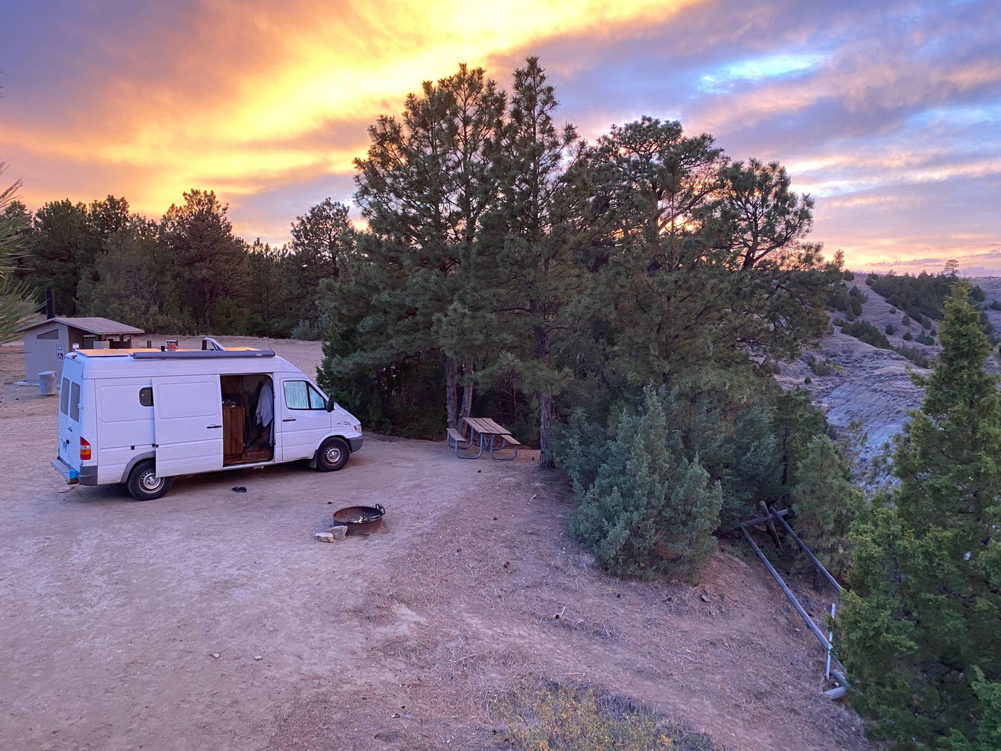 and an outdoor window view.|Cozy RV rental interior: wood-paneled walls