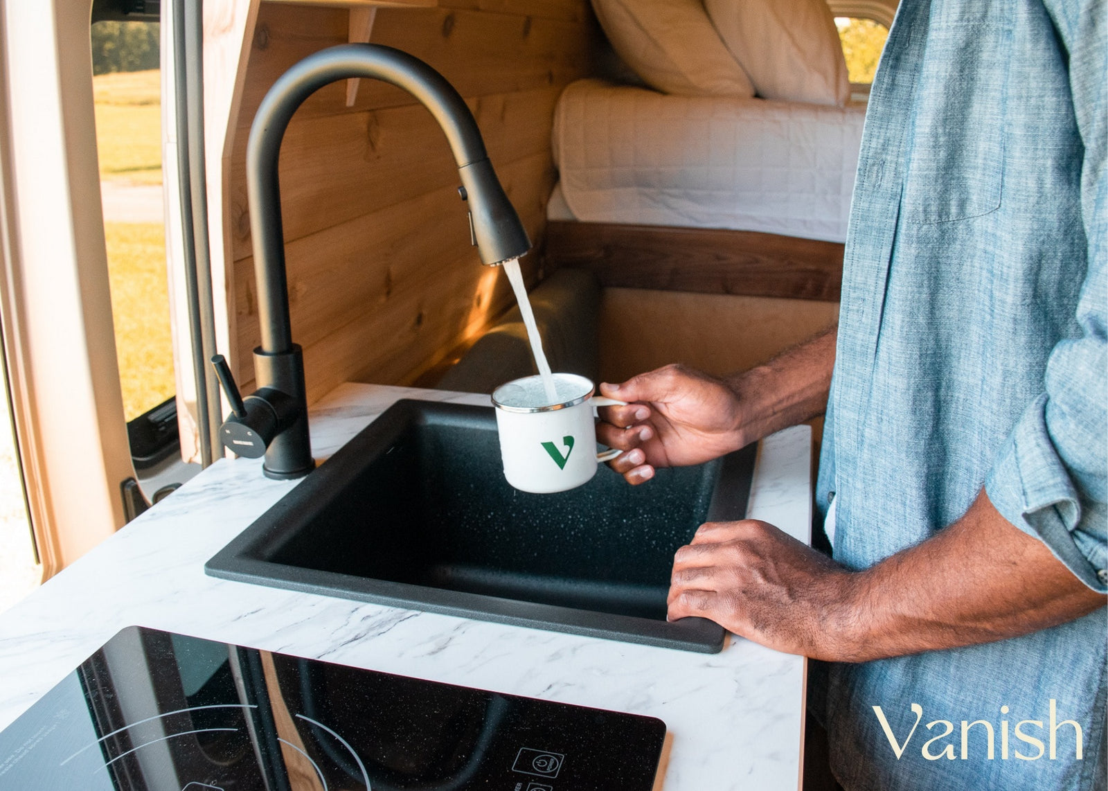 against huge cliffs.|Experience this RV rental campervan's cozy interior: bed