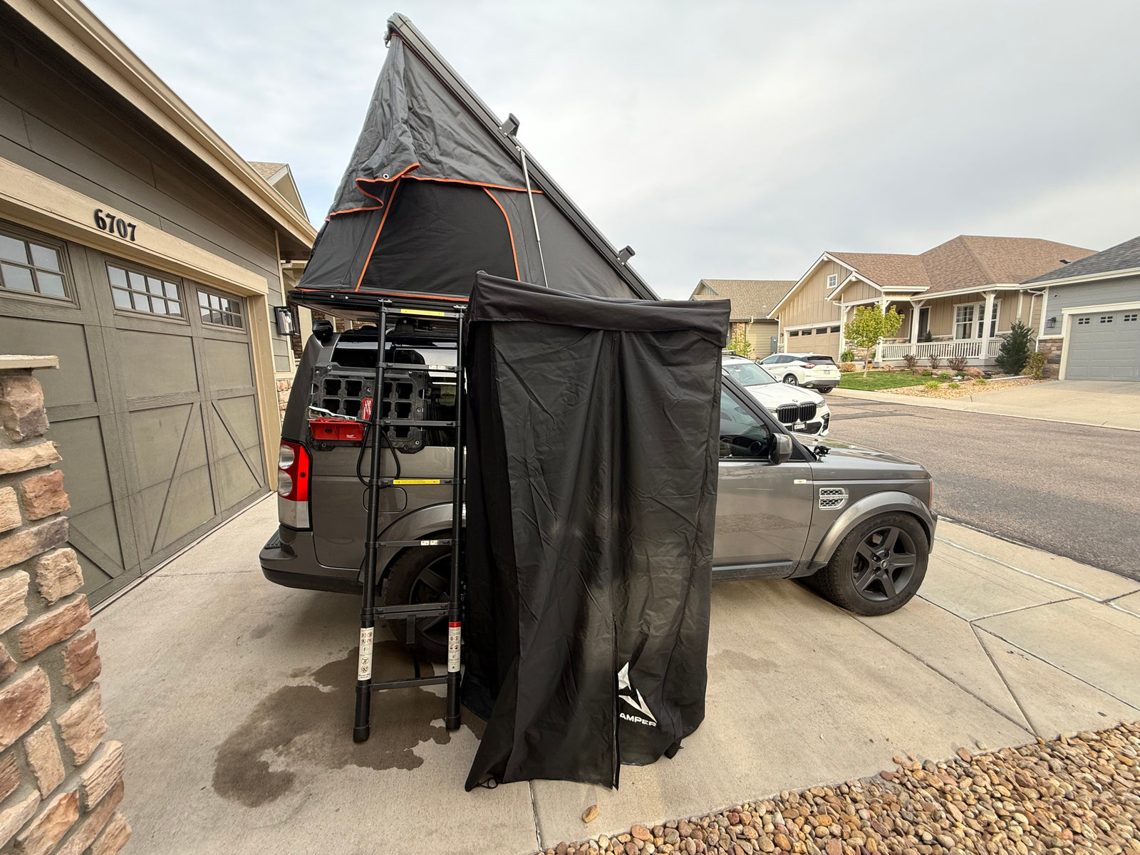 Explore with this rv rental featuring an overland SUV, deployed iKamper rooftop tent, and privacy room, ready for your next outdoor adventure.