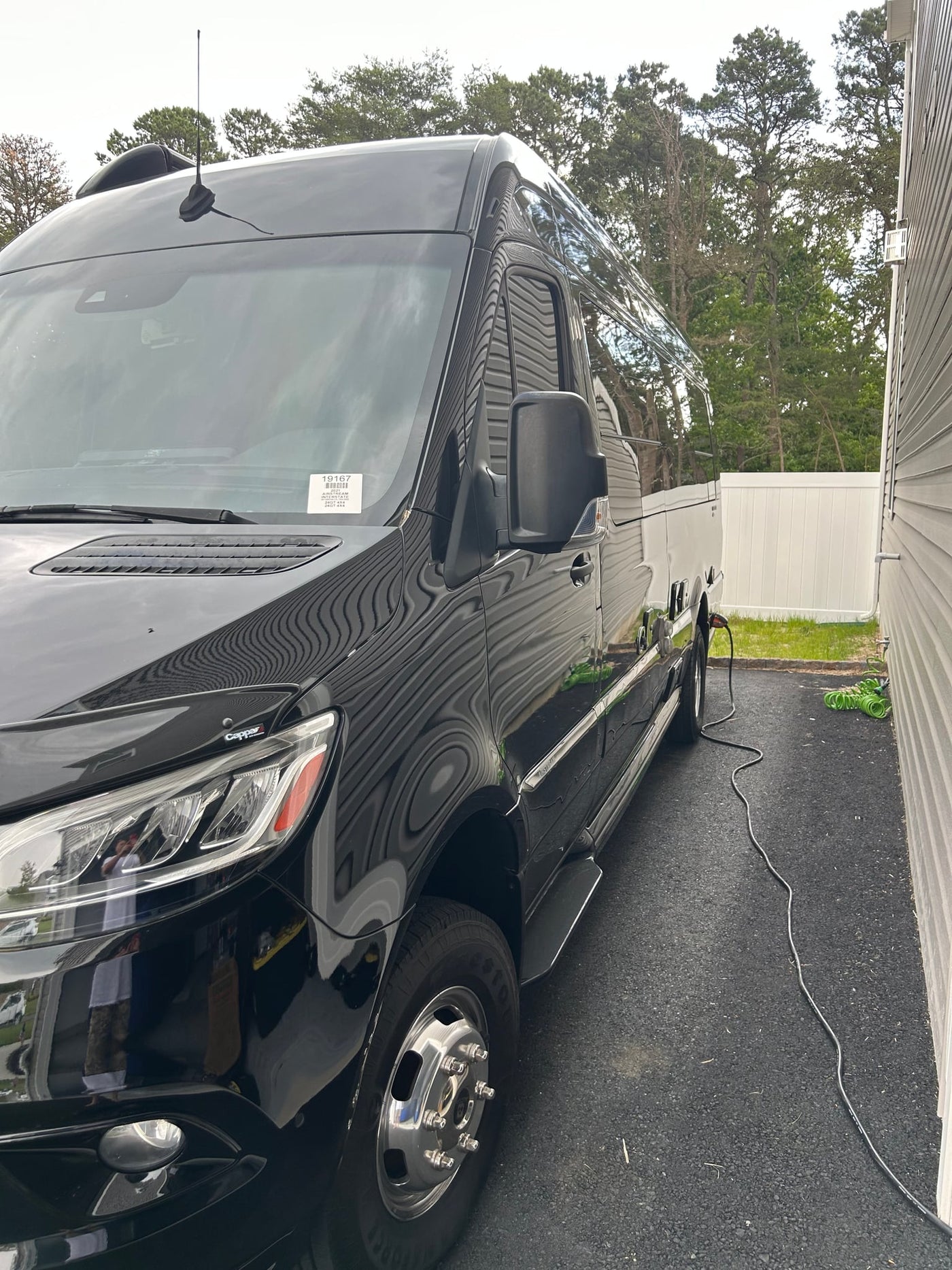 front view. Custom lights visible on bumper.|Black Airstream Interstate RV rental — photo 2