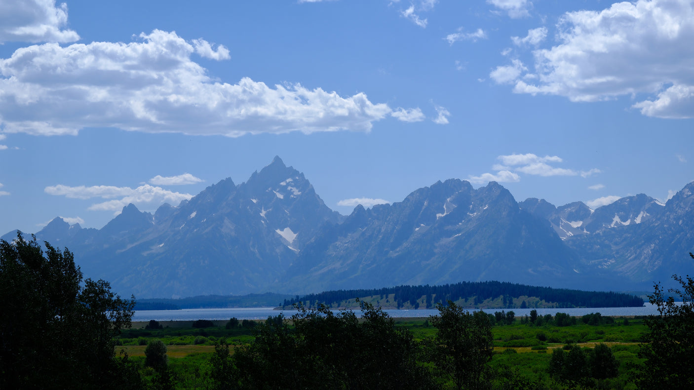 Stunning Grand Teton landscape with lake & mountains. An RV rental is perfect for exploring this scenic beauty.