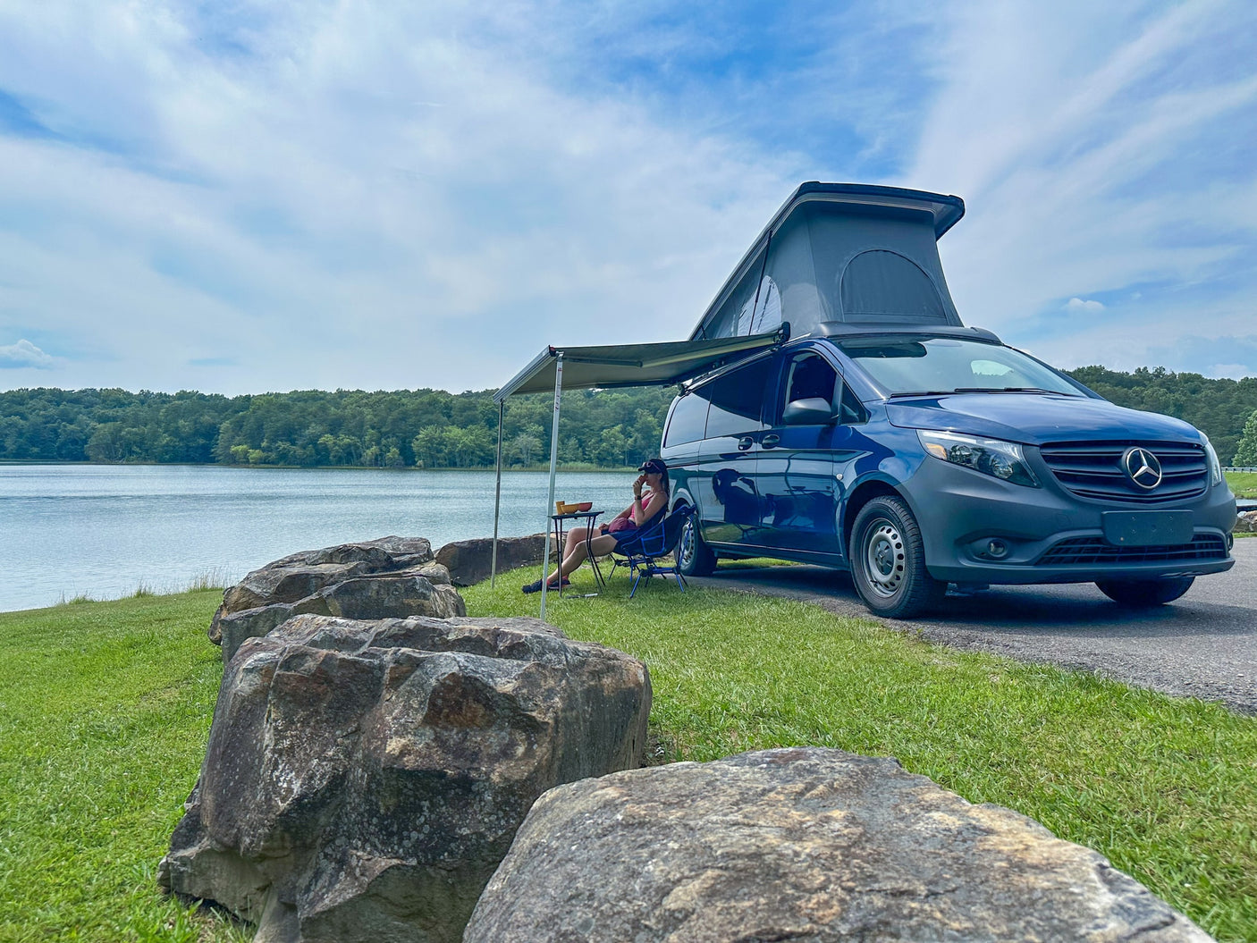and TV for comfortable journeys.|Relaxing in an RV rental camper van with a good book and a view. Pop-top