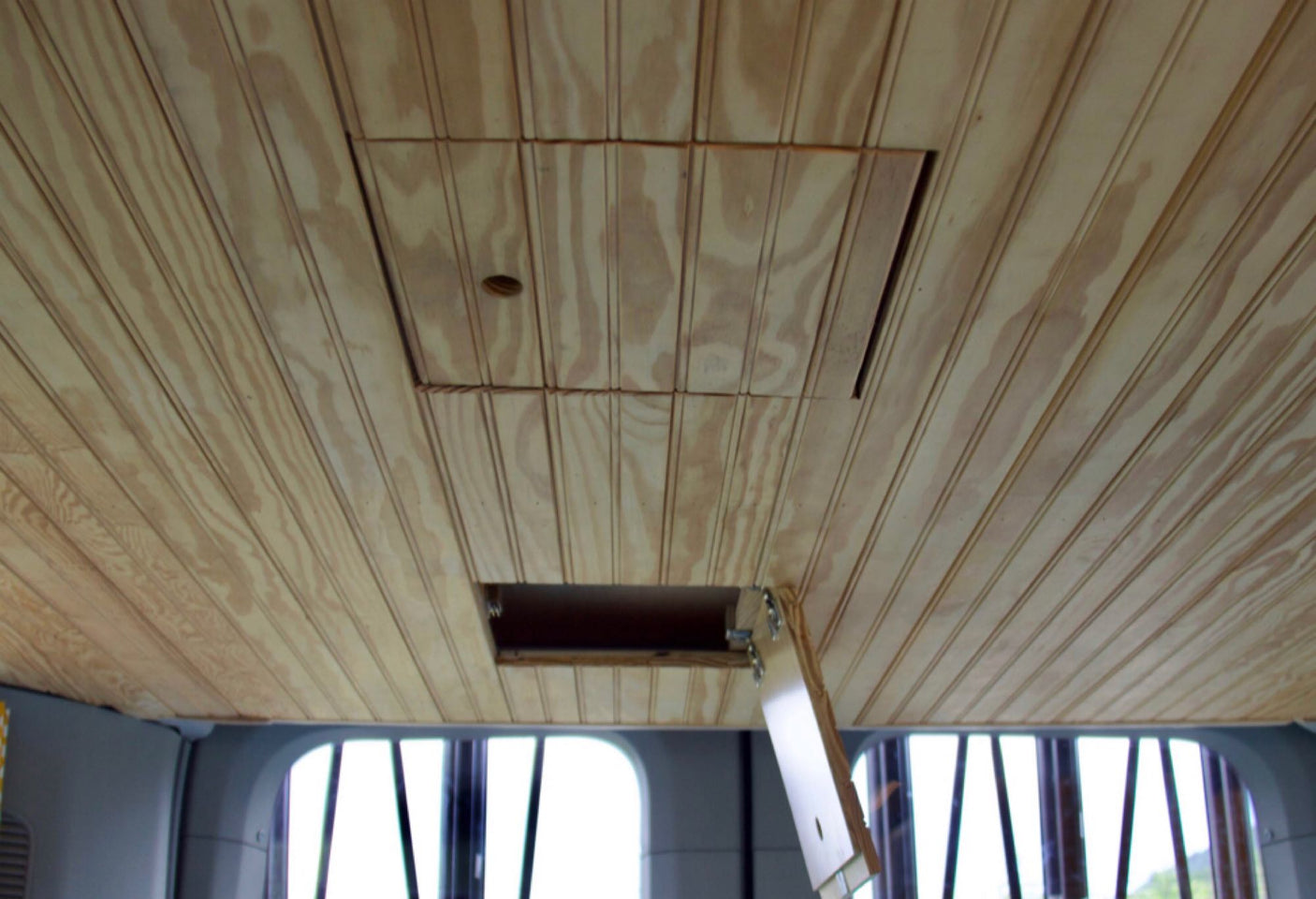 and storage. Ideal camper van setup!|Spacious RV rental van interior: custom cabinets