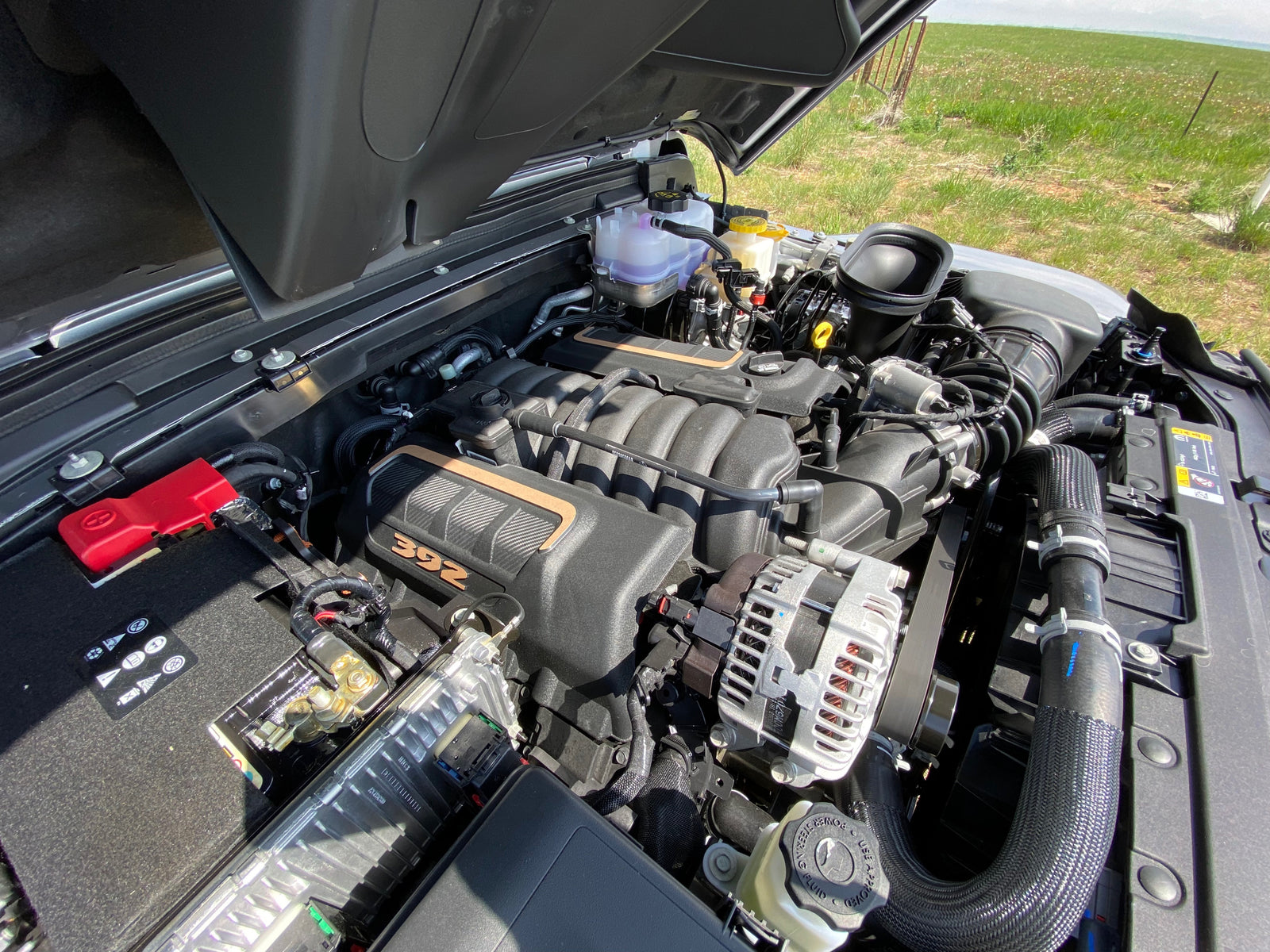 Detailed view of a powerful 392 HEMI engine under an open hood, ready for your next RV rental journey.