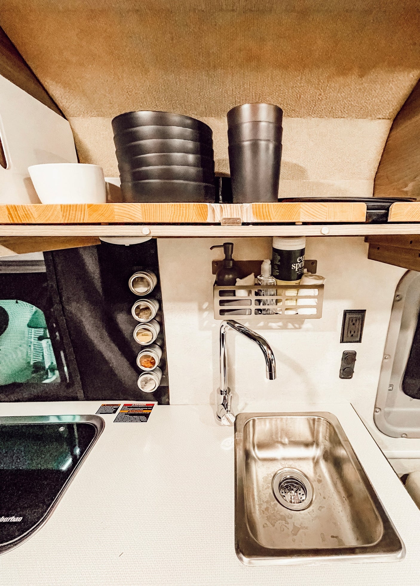 and utility setup are visible from the open back.|Stunning sunset views from your RV rental! This camper van interior