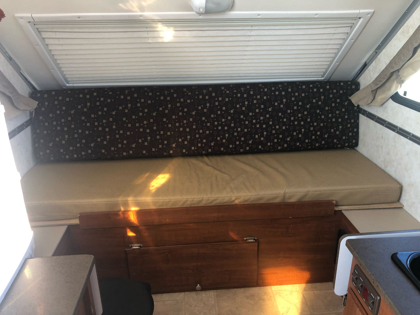 parked outdoors with its door open.|This A-liner Classic pop-up camper