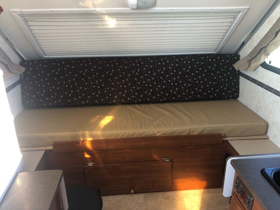parked outdoors with its door open.|This A-liner Classic pop-up camper