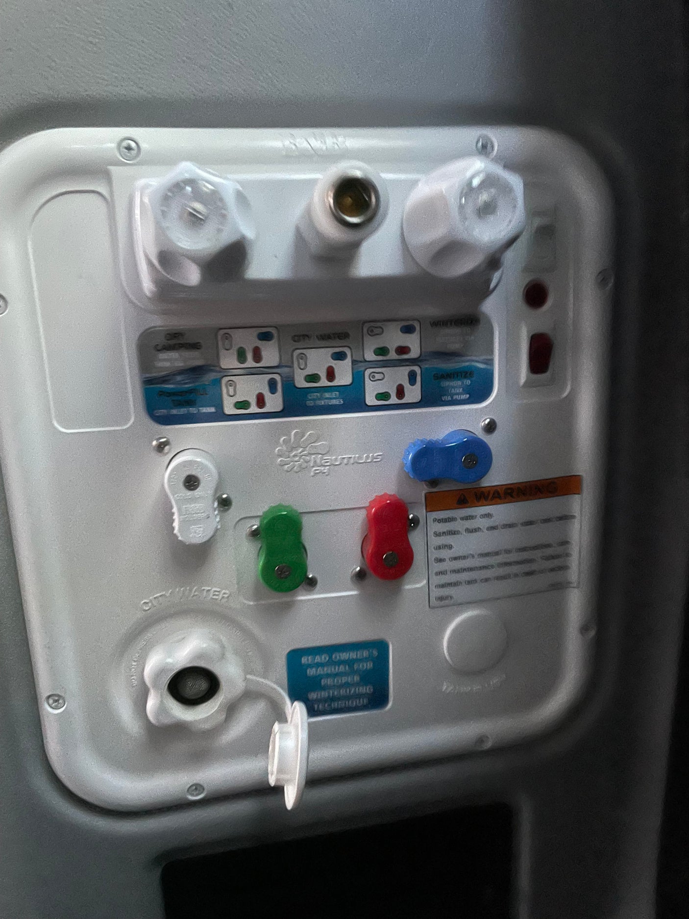 RV rental water system control panel: Nautilus P3, featuring valves and settings for city water, tank fill, and winterizing.