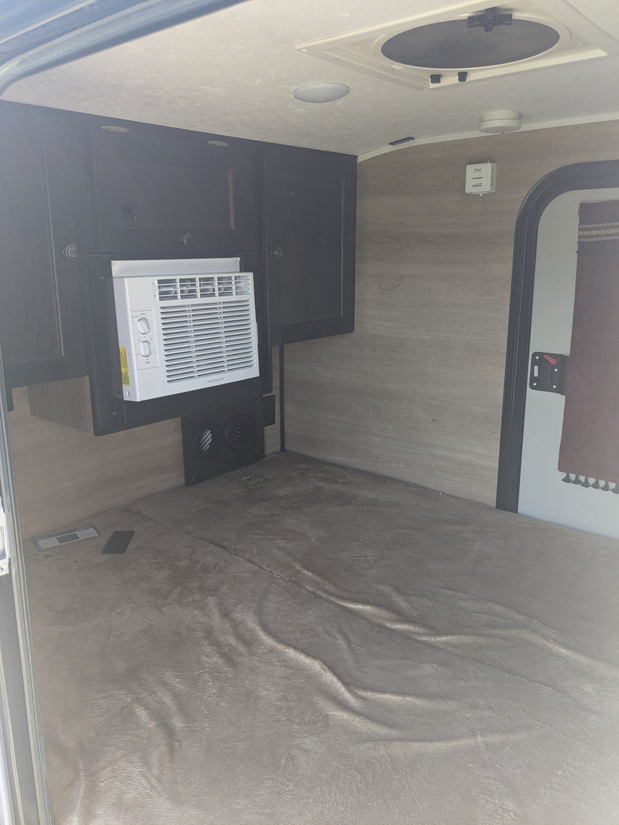 a grey teardrop camper