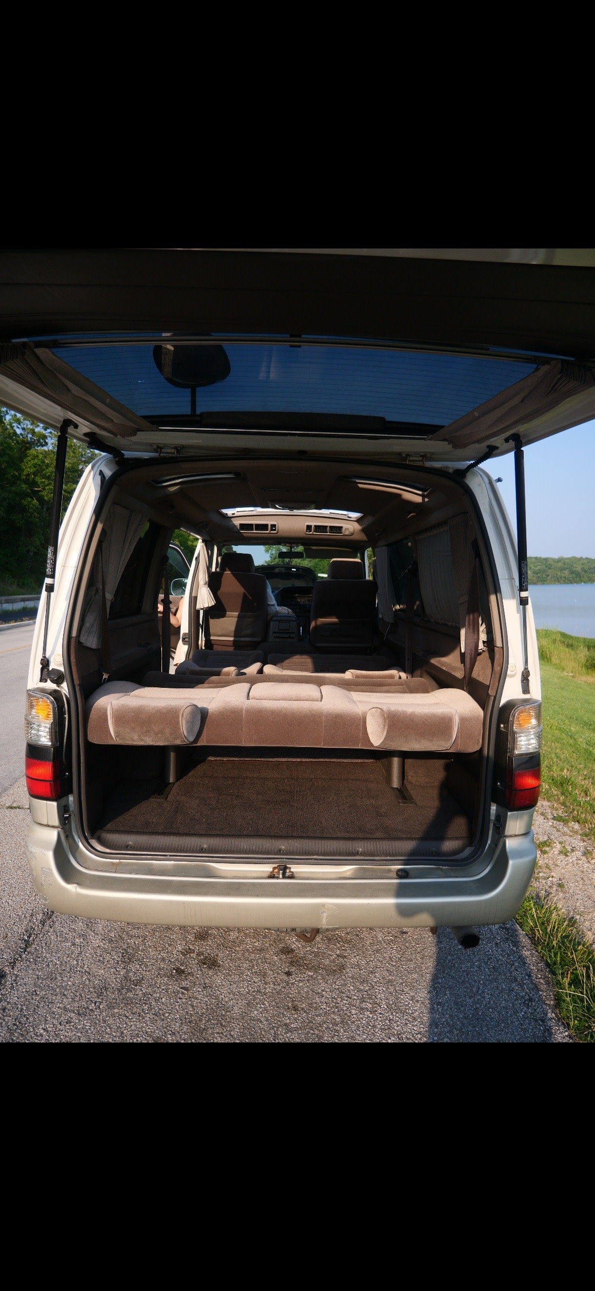 Spacious van interior with convertible seating, perfect for an rv rental adventure near the lake.