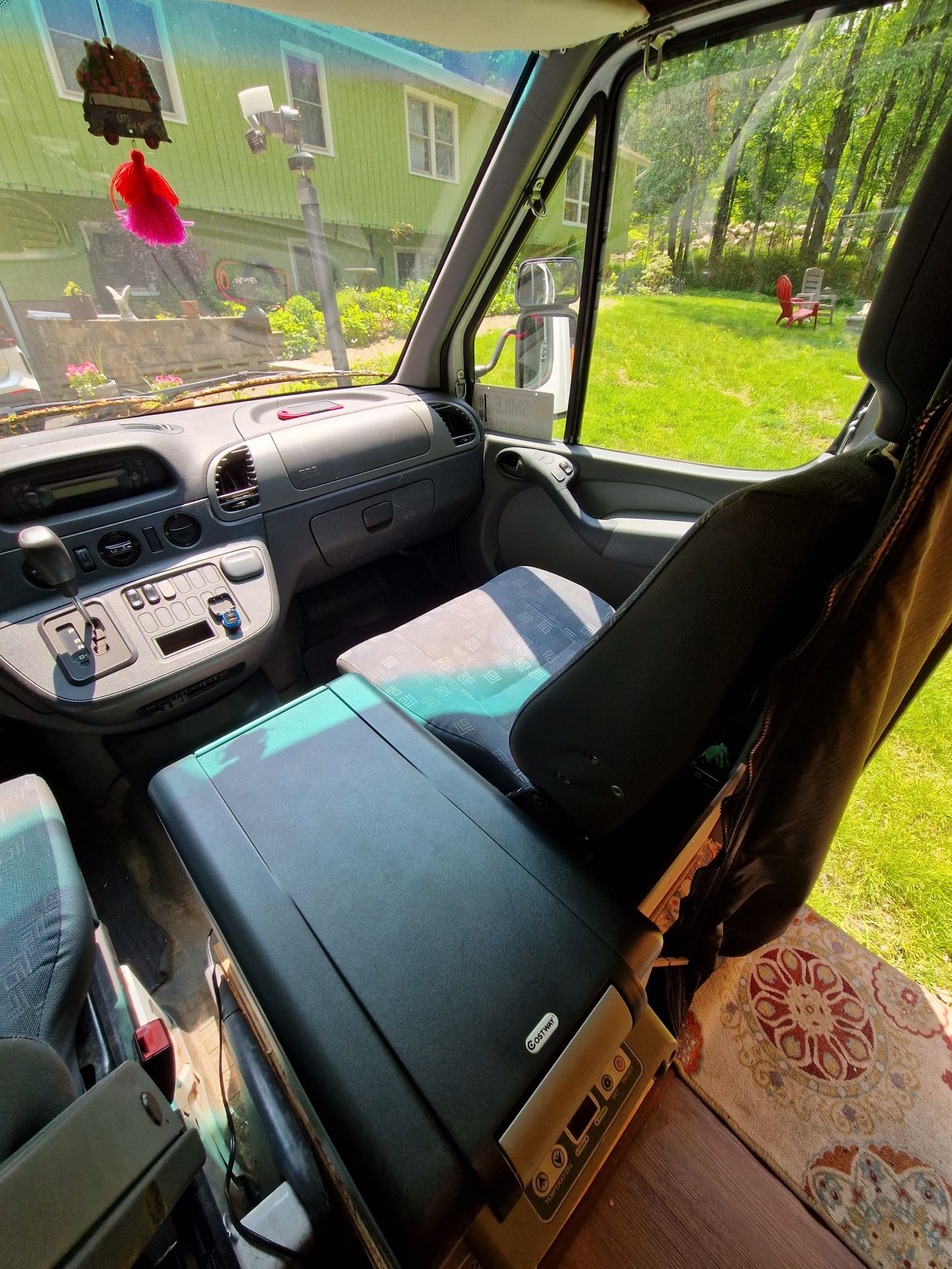 and custom wooden details for a cozy road trip.|Inside a comfy **RV rental**: wooden kitchen with sink