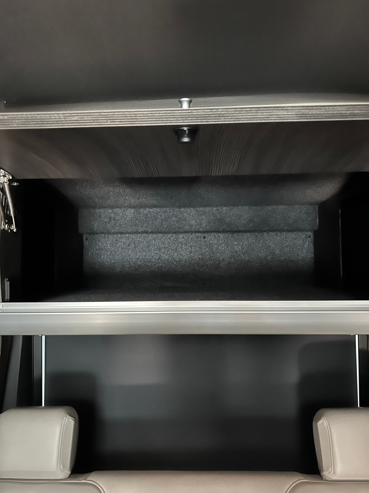 and wooden floor mat.|RV rental: White van with two colorful cruiser bikes on a rear rack — photo 15