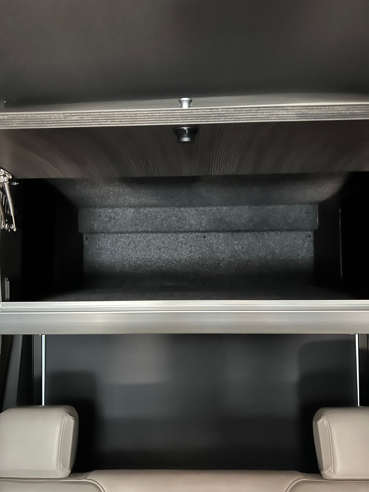 and wooden floor mat.|RV rental: White van with two colorful cruiser bikes on a rear rack