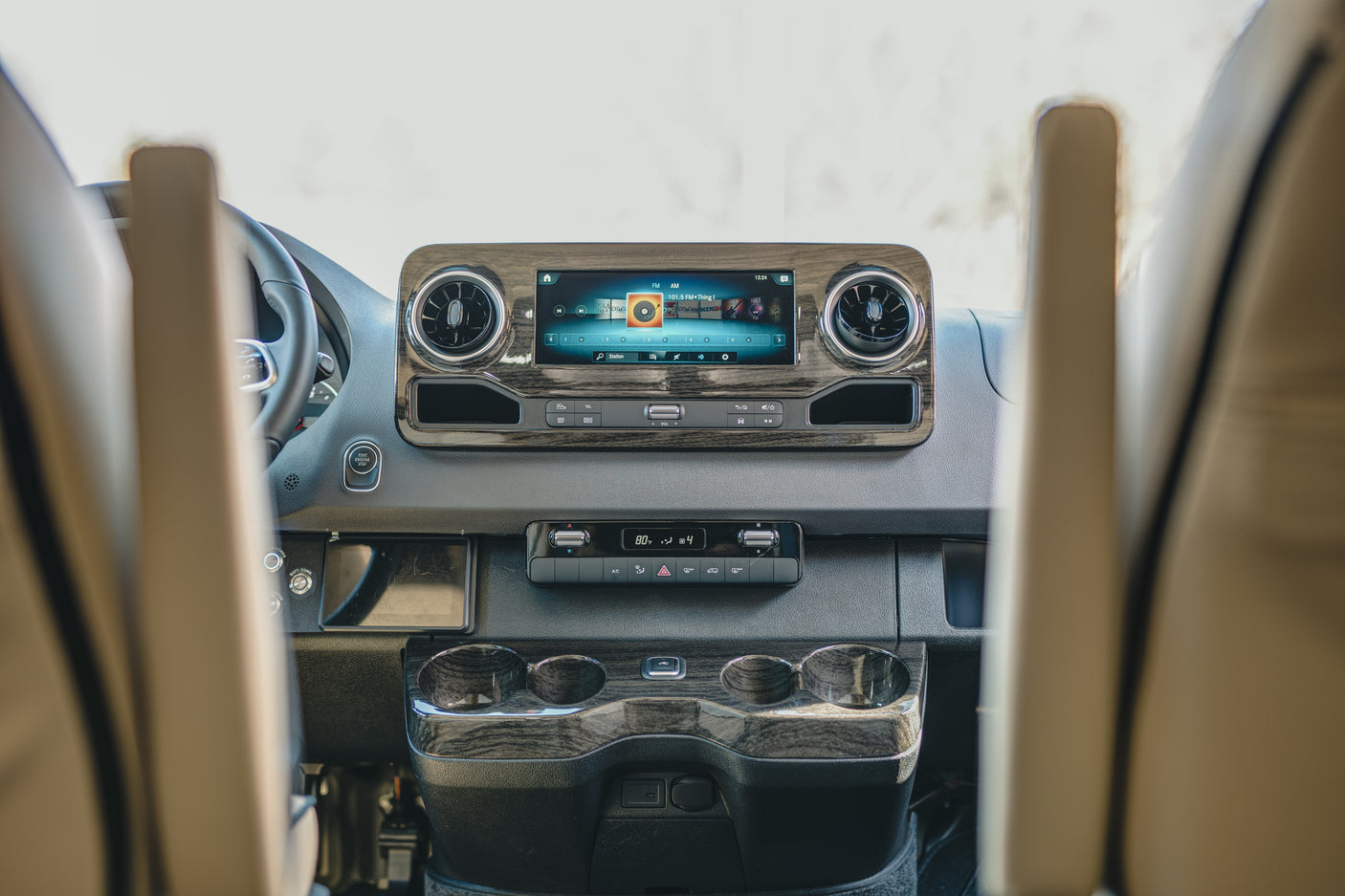 and modern lighting for ultimate comfort.|Premium rv rental interior: cream leather seats