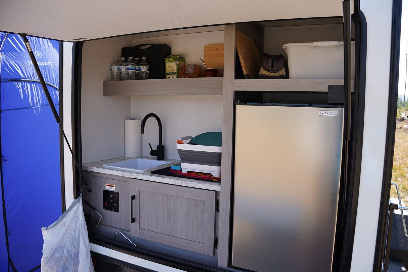 and OSB paneling.|White built-in AC unit inside an RV rental — photo 13