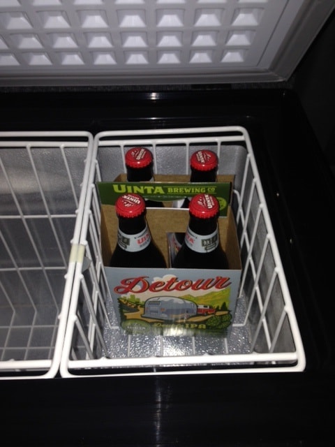 Chilled Uinta Detour beer, featuring an RV on its label, inside a cooler. Ideal for your RV rental journey. — photo 10