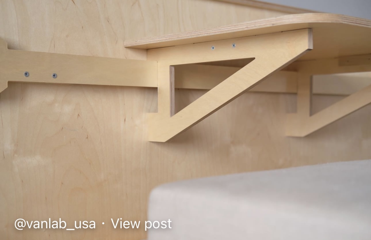 and seat back organizers.|Inside a modern van conversion: modular plywood setup with sink