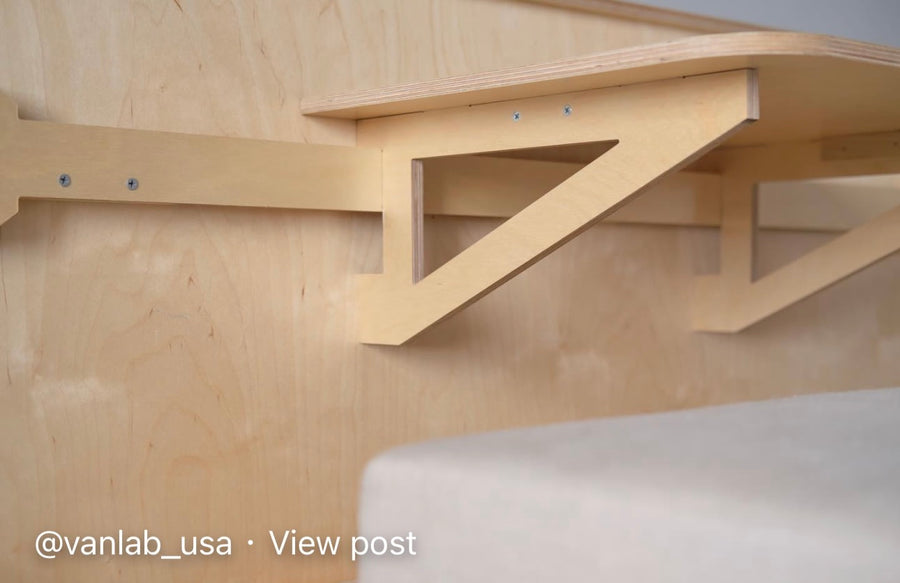 and seat back organizers.|Inside a modern van conversion: modular plywood setup with sink