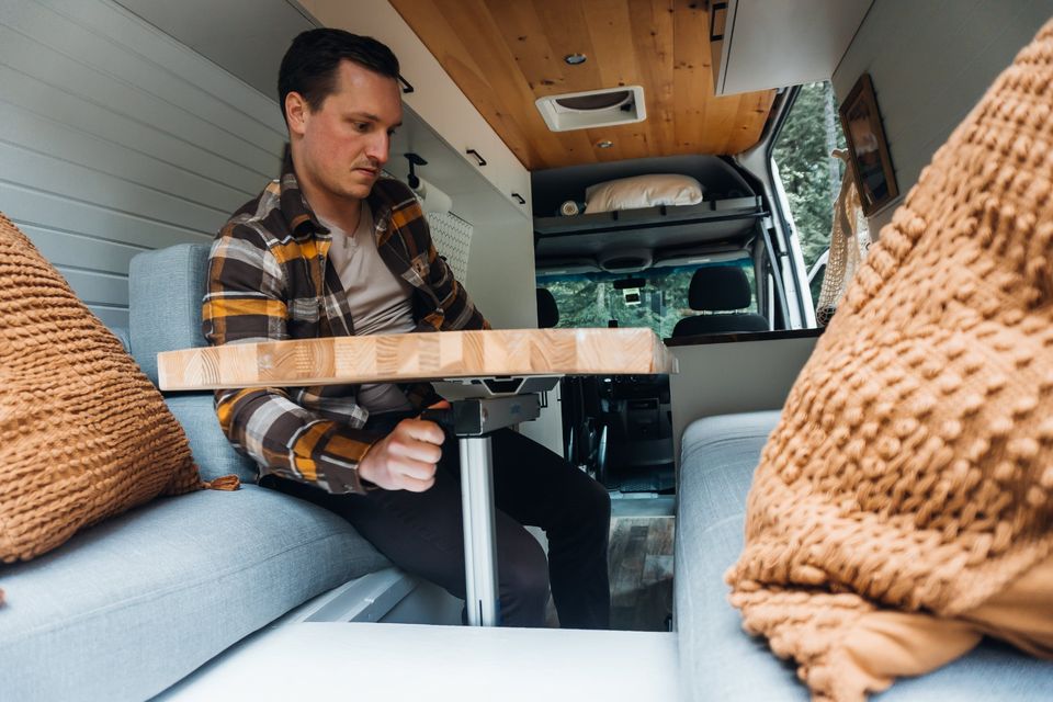 and a person.|Stylish and functional RV rental kitchen: black sink