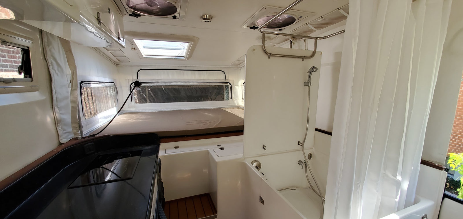 and cozy seating.|Spacious and bright rv rental interior featuring a practical kitchen
