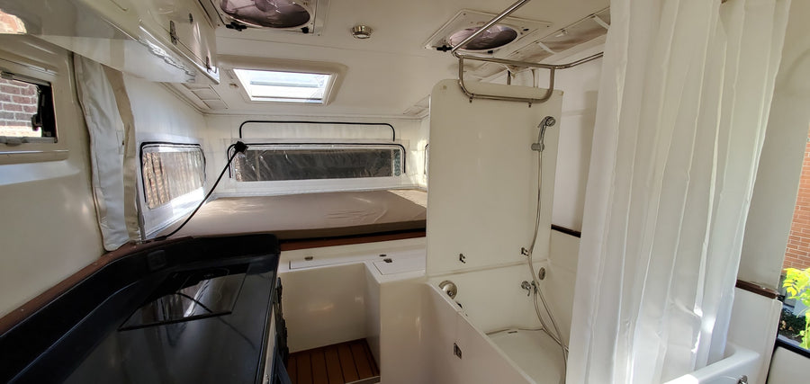 and cozy seating.|Spacious and bright rv rental interior featuring a practical kitchen
