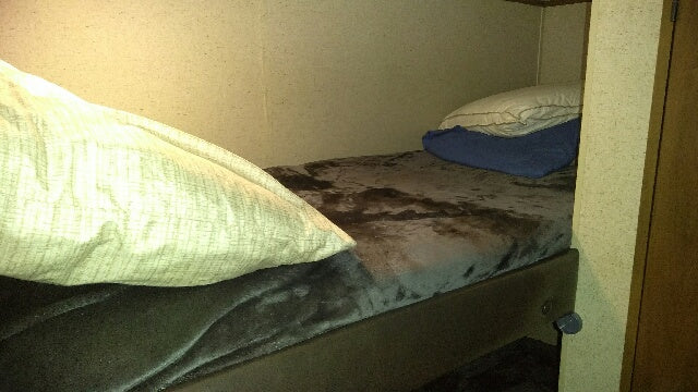 ideal for your next trip.|This RV rental interior shows a bed with zebra print