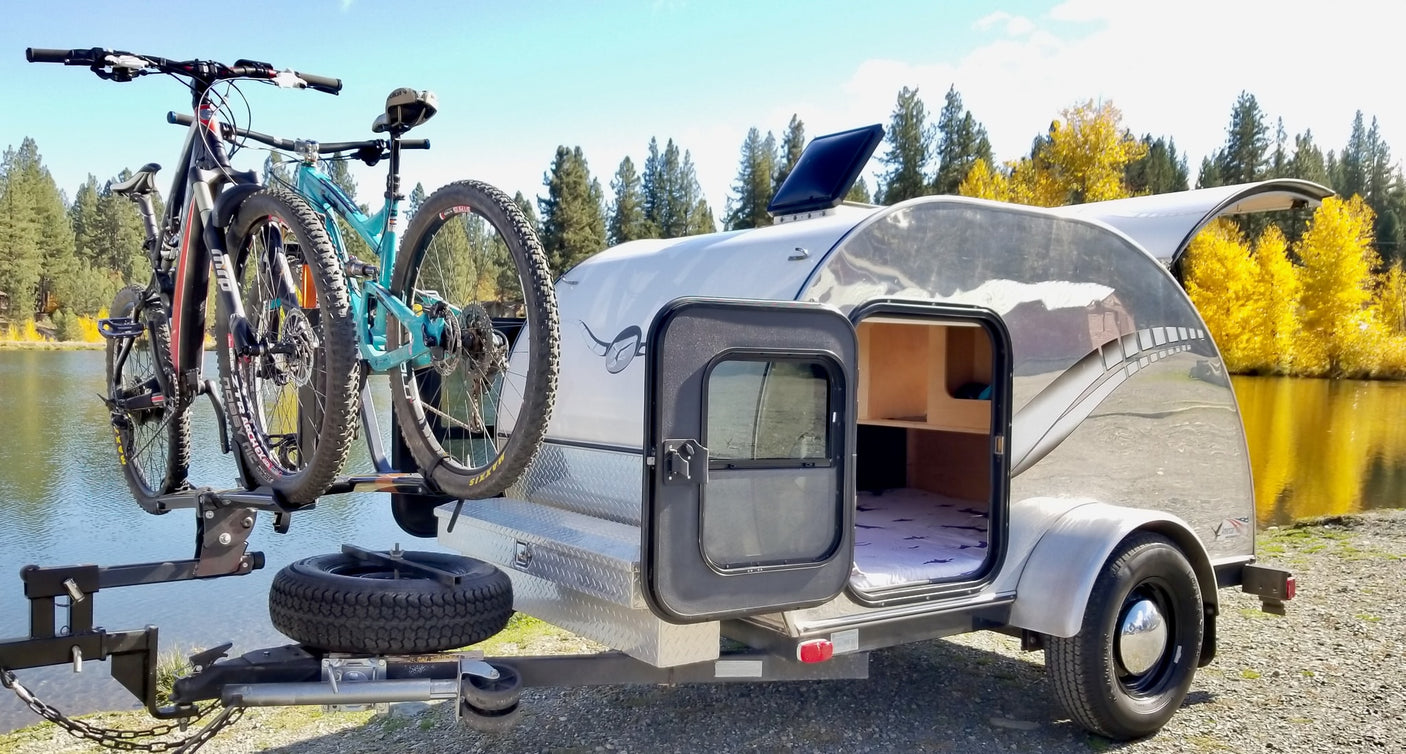 with a scenic lake & autumn trees.|Scenic RV rental camping: Teardrop trailer's outdoor kitchen