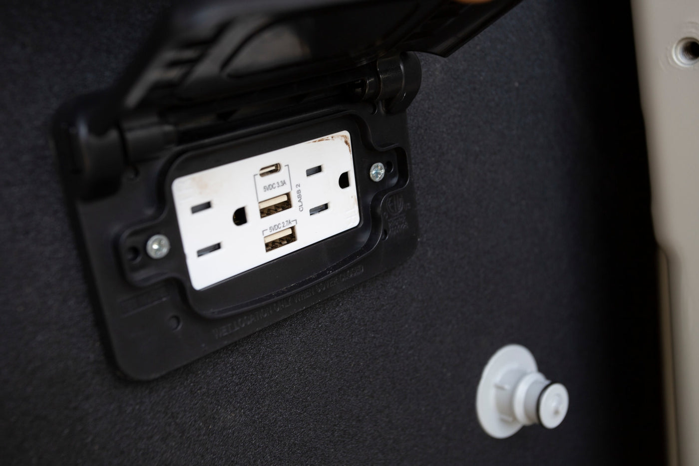 RV rental convenience: Built-in electrical outlet with two AC sockets, USB-C (3.3A) & USB-A (2.7A) charging ports. — photo 20