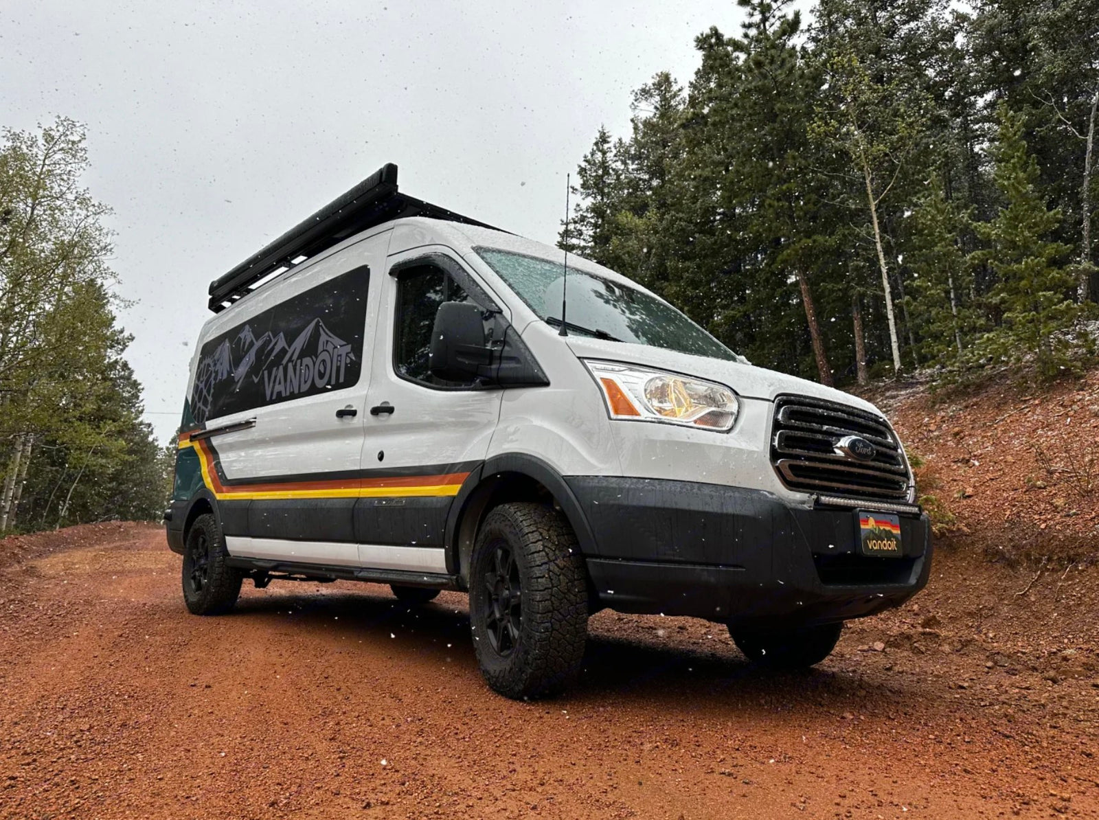 hooked up and ready for adventure.|Camper van rental under a vibrant sunset with a custom-designed van
