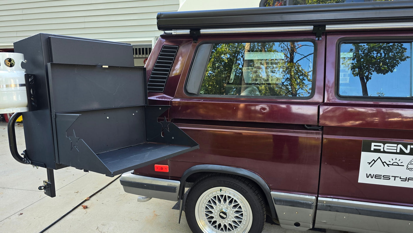 and cooking area. Perfect for your RV rental getaway.|Interior view of an RV rental showing a bed