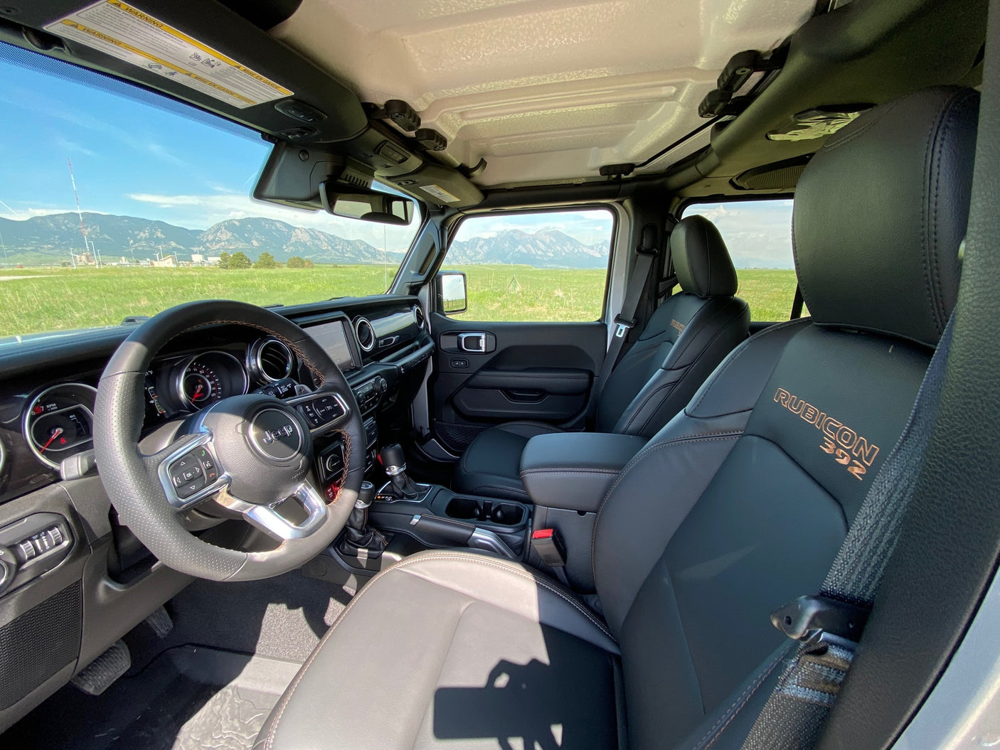 Spacious Jeep Rubicon 392 interior, mountain views. A rugged vehicle for your adventure, ideal with an RV rental.