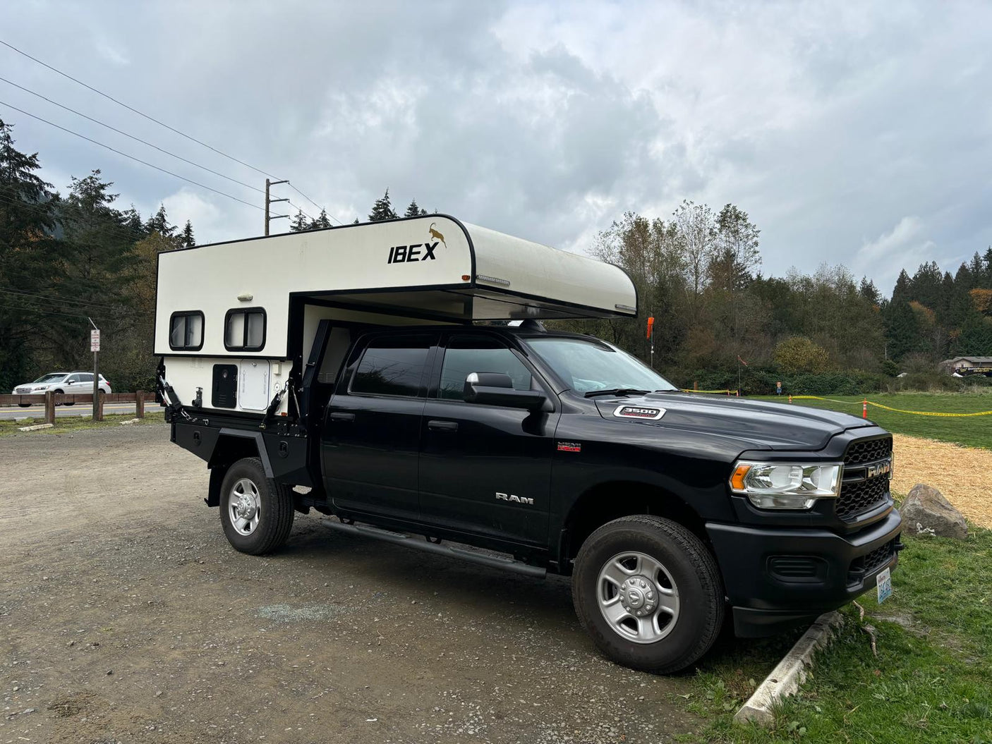 and bright windows.|Spacious RV rental interior. Features a large bed with floral bedding