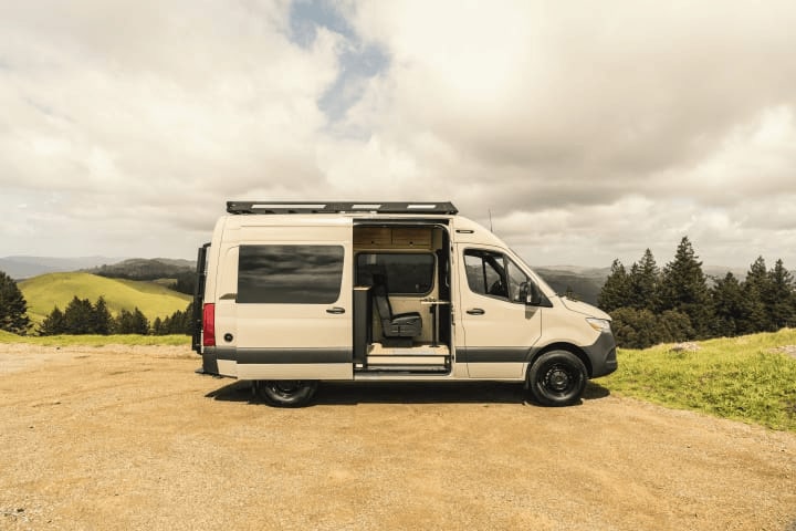 An rv rental camper van with its door open