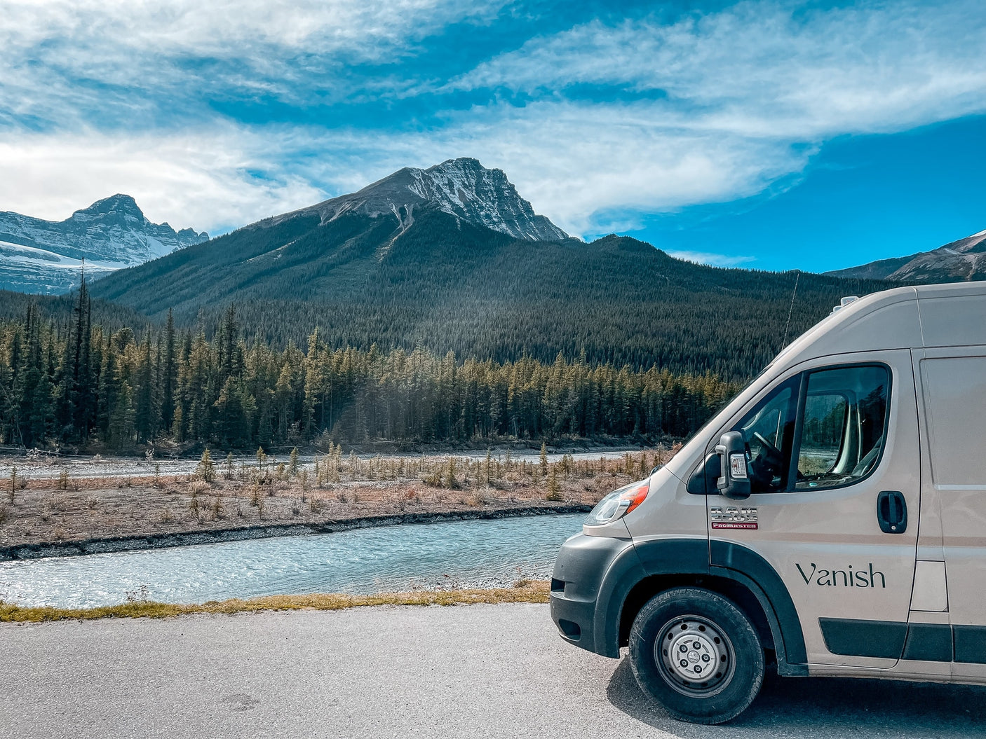 and compact wet bath.|A person wrapped in a blanket sips coffee from an RV rental