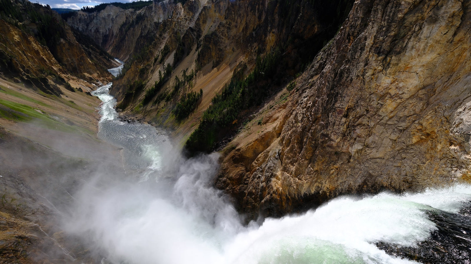 admiring unique geothermal terraces & a fascinating landscape.|Grey RV rental camper van parked on a dirt road