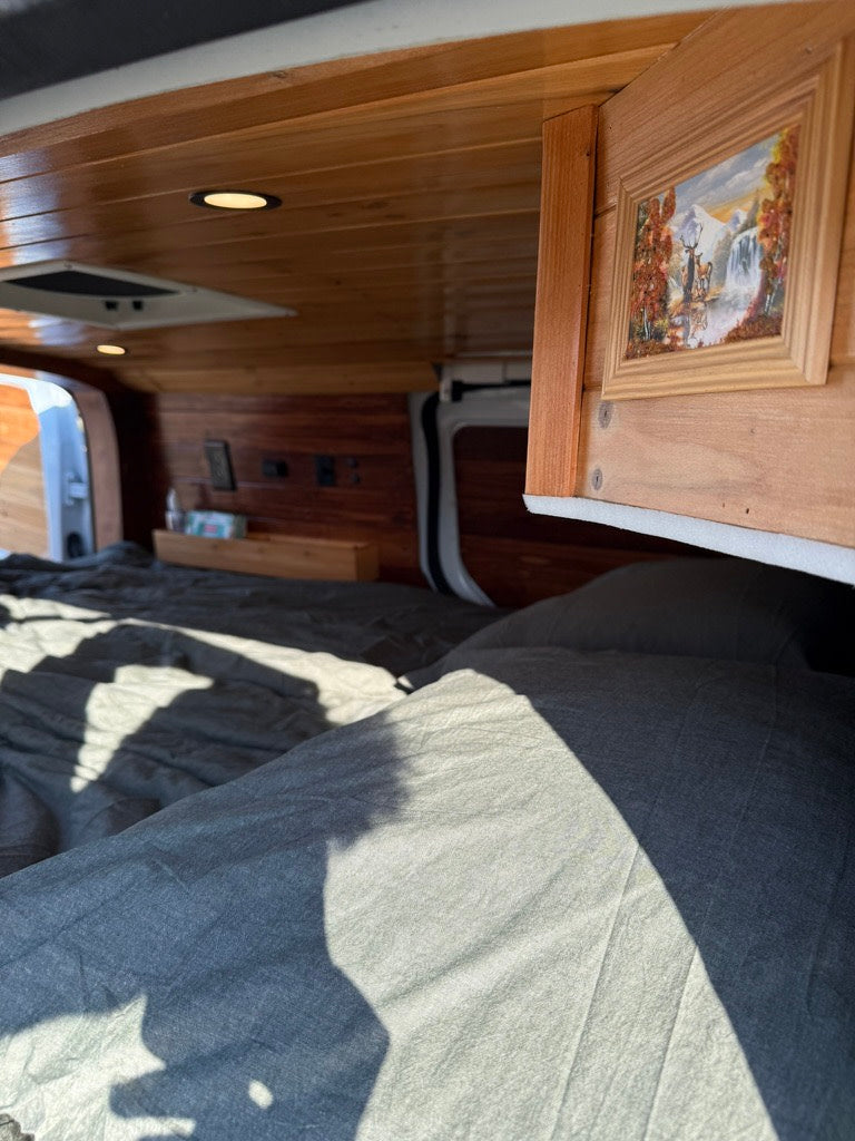 and cleaner.|RV rental essential: BougeRV portable fridge/freezer & Reliance water tank inside a camper van setup.|Inside this RV rental — photo 2