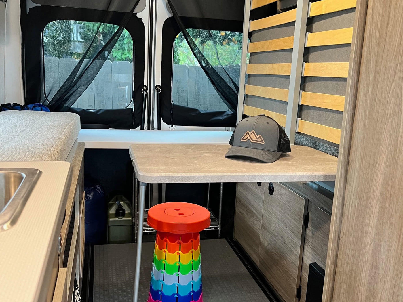 and pop-top access for efficient travel.|Adorable dog inside an RV rental. Modern interior with cream seats — photo 18