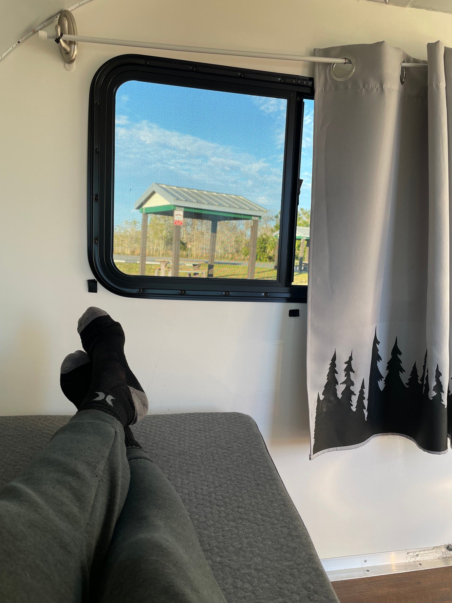 and a step stool.|Cozy RV rental interior featuring a wooden floor