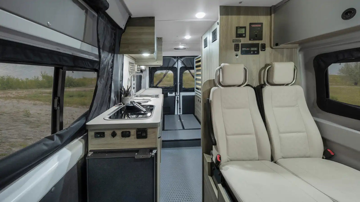 wooded campsite.|Step into this well-equipped rv rental. Features a full kitchen