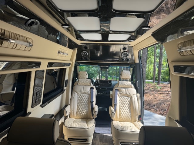featuring plush beige quilted seats