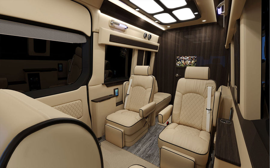 and dark wood finishes.|Luxury RV rental interior: cream quilted captain's chairs