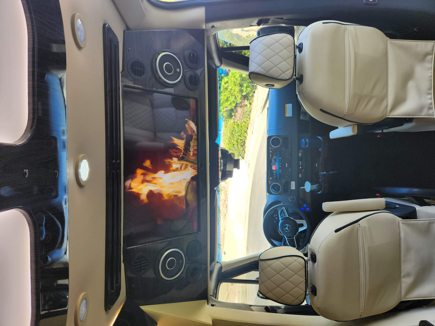 Experience comfort in this luxury RV rental van: plush seats, large TV entertainment, and a Mercedes-Benz cockpit.