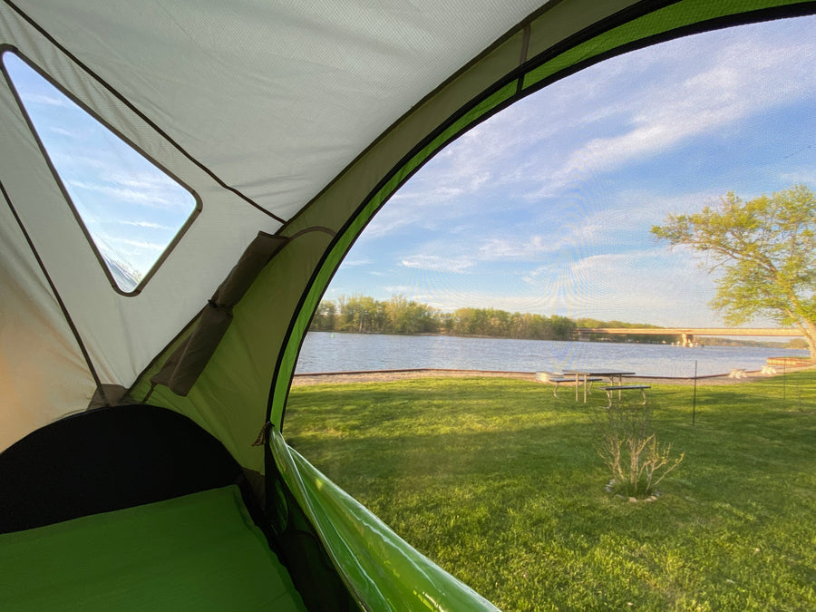 Waking up to this beautiful campsite view from inside a tent! Lakeside serenity, perfect for any RV rental road trip.